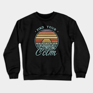 A vibrant sunset over a serene lake with the quote ‘Find Your Calm’ Crewneck Sweatshirt